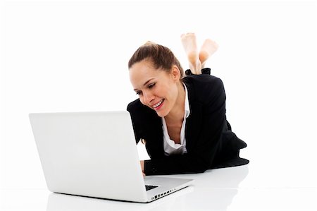 young businesswoman with laptop on the floor on white background studio Stock Photo - Budget Royalty-Free & Subscription, Code: 400-04220445