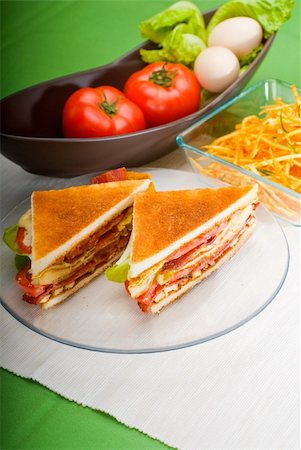 egg layer - fresh and delicious classic club sandwich over a transparent glass dish Stock Photo - Budget Royalty-Free & Subscription, Code: 400-04222482