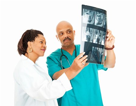 simsearch:400-05088220,k - Two doctors reviewing a patient's x-ray results.  Isolated on white. Stock Photo - Budget Royalty-Free & Subscription, Code: 400-04222660