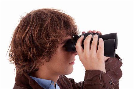 simsearch:400-04632747,k - Young boy looking through binoculars, isolated on white, studio shot Fotografie stock - Microstock e Abbonamento, Codice: 400-04223239