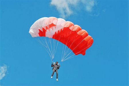 sky-diver (male) - The parachutist under a pink parachute against the blue sky Stock Photo - Budget Royalty-Free & Subscription, Code: 400-04223448