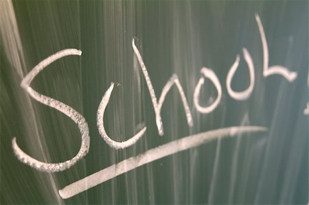 Closeup of the word "school" written on a green blackboard. Foto de stock - Super Valor sin royalties y Suscripción, Código: 400-04234602