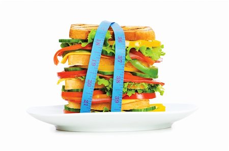 simsearch:400-04054010,k - Concept d'aliments sains avec un ruban à mesurer et sandwich sur fond blanc Photographie de stock - Aubaine LD & Abonnement, Code: 400-04234620