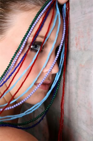 simsearch:400-04266572,k - Beautiful model with blue eyes holding strings of beads Stock Photo - Budget Royalty-Free & Subscription, Code: 400-04235166