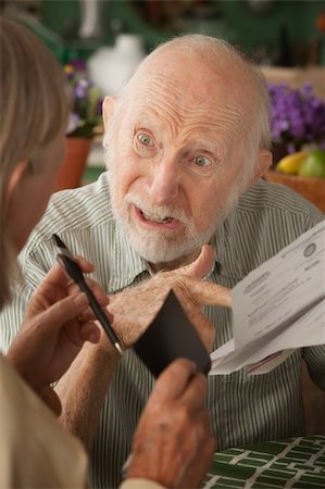 elderly couple concern - Senior couple at home with many bills Stock Photo - Budget Royalty-Free & Subscription, Code: 400-04235575