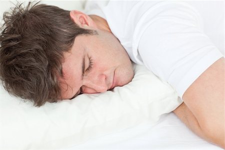 Young caucasian man sleeping in his bed at home Stock Photo - Budget Royalty-Free & Subscription, Code: 400-04235875