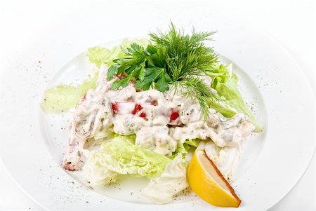 simsearch:400-04307416,k - Tasty salad of seafood and vegetable dish close up on a white background Foto de stock - Super Valor sin royalties y Suscripción, Código: 400-04235929