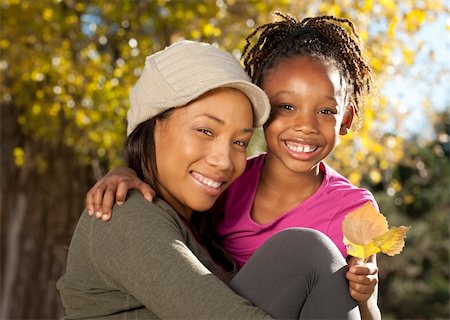 simsearch:400-04236555,k - African American mother and child having fun spending time together in a park Photographie de stock - Aubaine LD & Abonnement, Code: 400-04236556