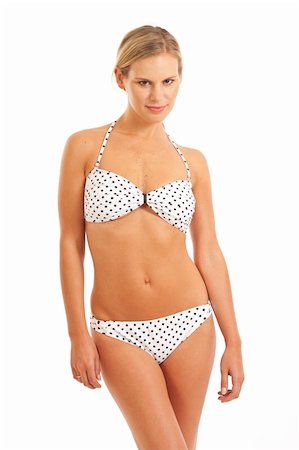 Young woman in white bikini with polka dots Stock Photo - Budget Royalty-Free & Subscription, Code: 400-04236956
