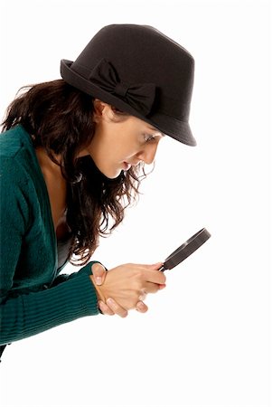 simsearch:400-04554899,k - young woman with magnifier glass and hat looking for something isolated on white background Stock Photo - Budget Royalty-Free & Subscription, Code: 400-04237195