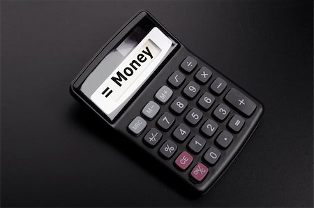 simsearch:400-07169223,k - money word on calculator showing financial investment banking or savings concept Stock Photo - Budget Royalty-Free & Subscription, Code: 400-04237544