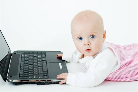 simsearch:400-04129482,k - baby with laptop on a white background in studio Photographie de stock - Aubaine LD & Abonnement, Code: 400-04237834