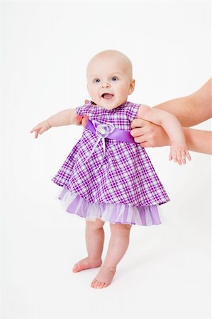 simsearch:400-04140663,k - Baby in dress on a white background Photographie de stock - Aubaine LD & Abonnement, Code: 400-04237836