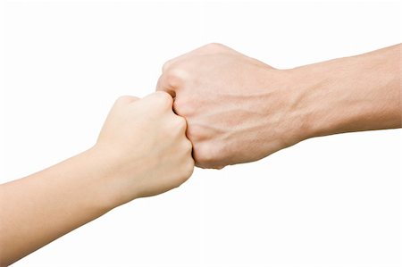 shaking hands kids - Fist of the child rests on the fist man on an isolated white background Stock Photo - Budget Royalty-Free & Subscription, Code: 400-04237849