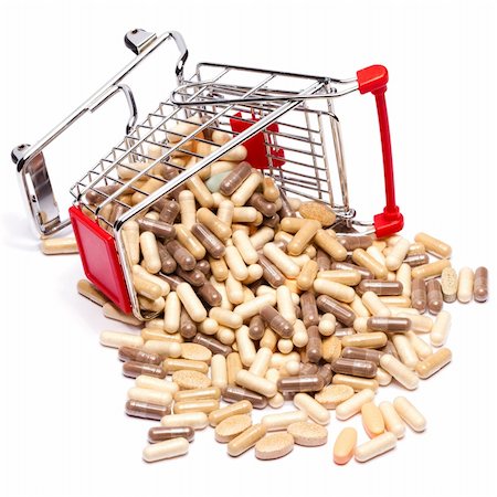 Carts on a white background filled with pills Stock Photo - Budget Royalty-Free & Subscription, Code: 400-04237899