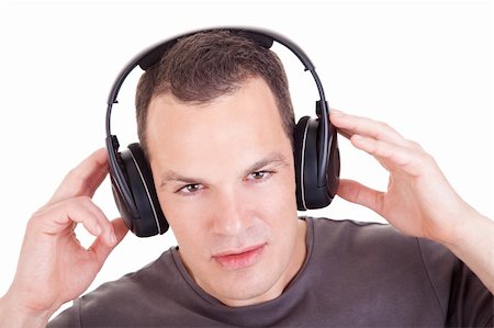 man listening music in headphones, isolated on white background, studio shot Stock Photo - Budget Royalty-Free & Subscription, Code: 400-04238105