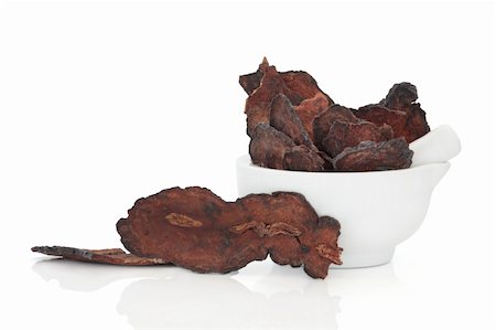 simsearch:400-06521200,k - Fleece flower root in a porcelain mortar with pestle and loose, isolated over white background. Used in traditional chinese herbal medicine. He shon wu. Radix polygoni multifori. Stock Photo - Budget Royalty-Free & Subscription, Code: 400-04239182