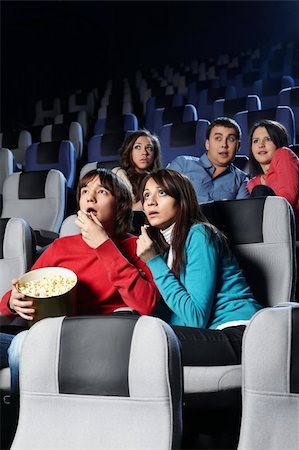 Group of young people look a film at a cinema Stock Photo - Budget Royalty-Free & Subscription, Code: 400-04239287