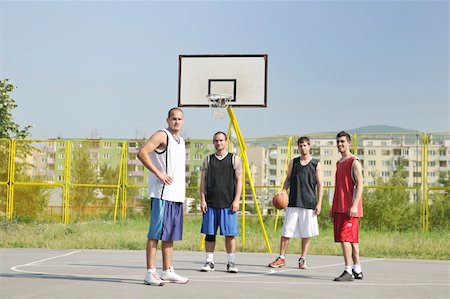 basketball player team group  posing on streetbal court at the city on early morning Stock Photo - Budget Royalty-Free & Subscription, Code: 400-04239597