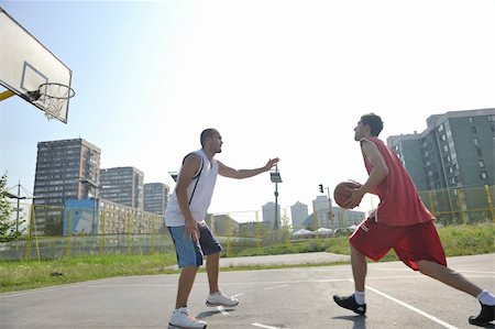 streetball basketball game with two young players at early morning on city court Stock Photo - Budget Royalty-Free & Subscription, Code: 400-04239592