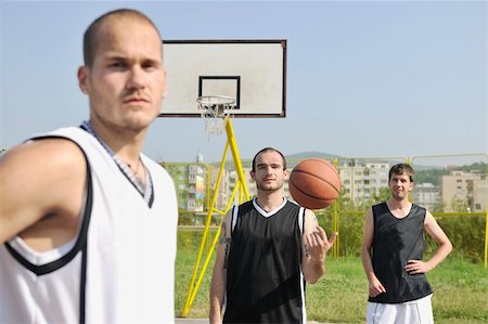basketball player team group  posing on streetbal court at the city on early morning Stock Photo - Budget Royalty-Free & Subscription, Code: 400-04239611