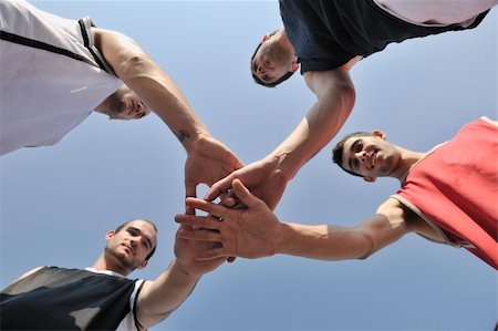 basketball player team group  posing on streetbal court at the city on early morning Stock Photo - Budget Royalty-Free & Subscription, Code: 400-04239622