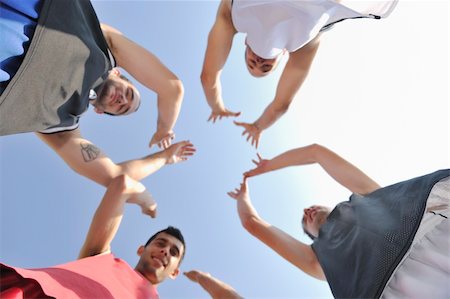 basketball player team group  posing on streetbal court at the city on early morning Stock Photo - Budget Royalty-Free & Subscription, Code: 400-04239638