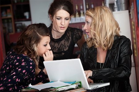 Serious and pretty young college girls studying in a cafe Stock Photo - Budget Royalty-Free & Subscription, Code: 400-04239734