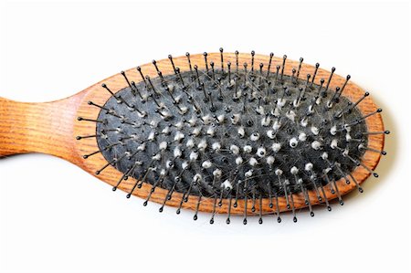 A close-up of a dirty hairbrush over white background Stock Photo - Budget Royalty-Free & Subscription, Code: 400-04230774