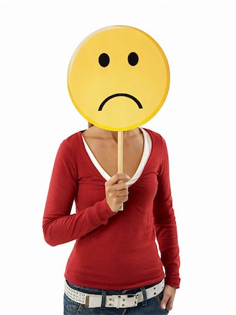 sad yellow icon - young adult woman holding sad emoticon on white background. Vertical shape, waist up Stock Photo - Budget Royalty-Free & Subscription, Code: 400-04230868