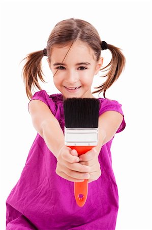 Happy girl sitting on floor holding a paint-brush Stock Photo - Budget Royalty-Free & Subscription, Code: 400-04230860