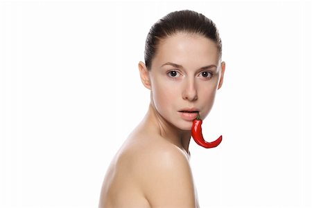 simsearch:400-04575822,k - Portrait of a beautiful woman with chili pepper. Isolated on white background Photographie de stock - Aubaine LD & Abonnement, Code: 400-04230979