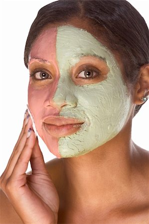 simsearch:400-03935575,k - Woman with special facial mask applied on her face. The mask consist of two colors (red and green), each cover different part Stock Photo - Budget Royalty-Free & Subscription, Code: 400-04231020