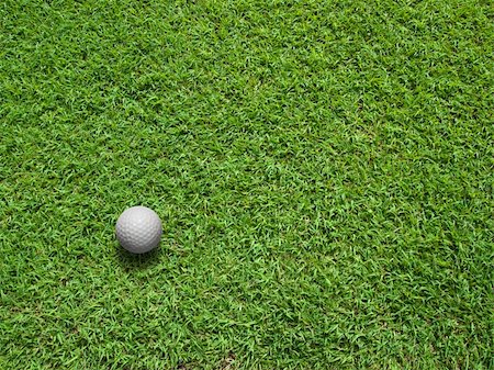 simsearch:400-05731622,k - Top View of white Golf ball on Green Grass Stock Photo - Budget Royalty-Free & Subscription, Code: 400-04231212