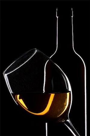 simsearch:400-04279337,k - White wine bottle and glass silhouette over black background Foto de stock - Super Valor sin royalties y Suscripción, Código: 400-04231244