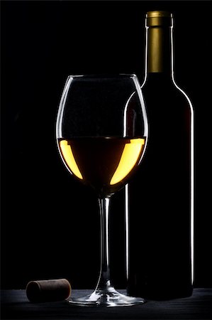 elegant wine tasting - White wine bottle and glass silhouette over black background Stock Photo - Budget Royalty-Free & Subscription, Code: 400-04231243