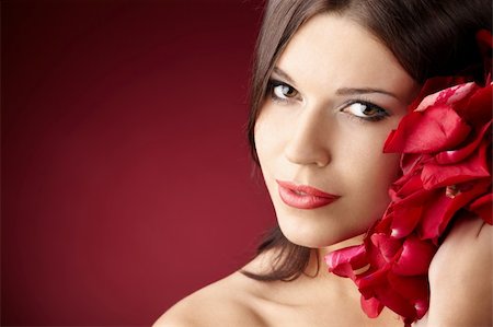 simsearch:400-04231314,k - Portrait of the pretty girl with the red petals, isolated Foto de stock - Super Valor sin royalties y Suscripción, Código: 400-04231317