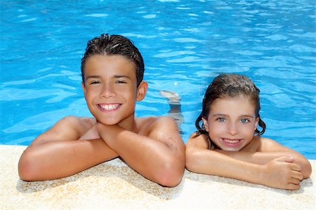 teen boy and little girl summer vacation in blue swimming pool Foto de stock - Super Valor sin royalties y Suscripción, Código: 400-04231374