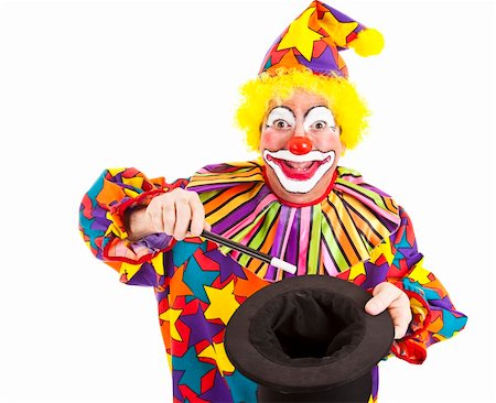 simsearch:400-04408991,k - Cheerful birthday clown does a magic trick with a want and top hat.  Isolated on white. Foto de stock - Super Valor sin royalties y Suscripción, Código: 400-04231390