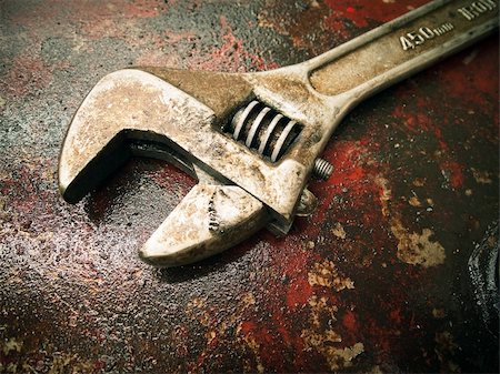 Old dirty Wrench on the fuel tank drop red background Stock Photo - Budget Royalty-Free & Subscription, Code: 400-04231616