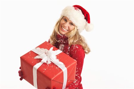 simsearch:400-04774270,k - Young woman with Santa hat holding present Stock Photo - Budget Royalty-Free & Subscription, Code: 400-04232319