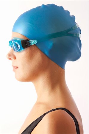 female swimmer cap goggles - Close up portrait of young woman with swim cap and  swimming goggles Stock Photo - Budget Royalty-Free & Subscription, Code: 400-04232326