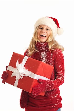 simsearch:400-04774270,k - Young woman with Santa hat holding present Stock Photo - Budget Royalty-Free & Subscription, Code: 400-04232322