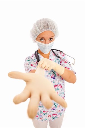 doctor with cap and mask - Portrait of young nurse putting on rubber gloves Stock Photo - Budget Royalty-Free & Subscription, Code: 400-04232443