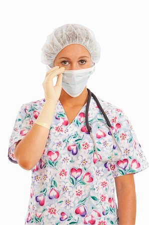 doctor with cap and mask - Portrait of young woman nurse in scrubs pulling on mask Stock Photo - Budget Royalty-Free & Subscription, Code: 400-04232452