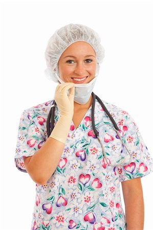 doctor with cap and mask - Portrait of young woman nurse in scrubs pulling on mask Stock Photo - Budget Royalty-Free & Subscription, Code: 400-04232453