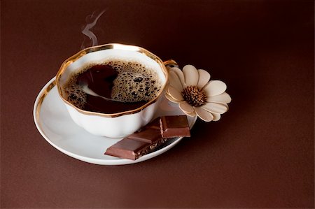 simsearch:400-04232483,k - The cup of coffee with chocolate on brown background Stock Photo - Budget Royalty-Free & Subscription, Code: 400-04232482