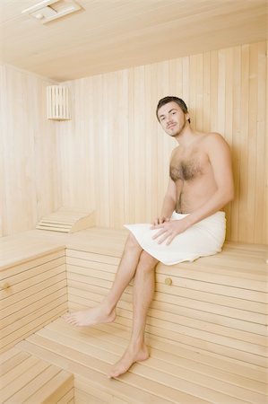 Young handsome man in a towel relaxing in a russian wooden sauna Stock Photo - Budget Royalty-Free & Subscription, Code: 400-04232544