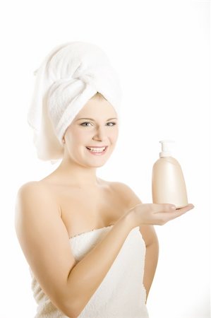 simsearch:400-04127590,k - Young beautiful woman with healthy pure skin and white towel on her head holding moisturising cream in bathroom Stock Photo - Budget Royalty-Free & Subscription, Code: 400-04232542
