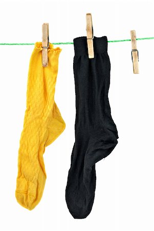 Yellow and black socks hanging on rope isolated on the white background Photographie de stock - Aubaine LD & Abonnement, Code: 400-04233028